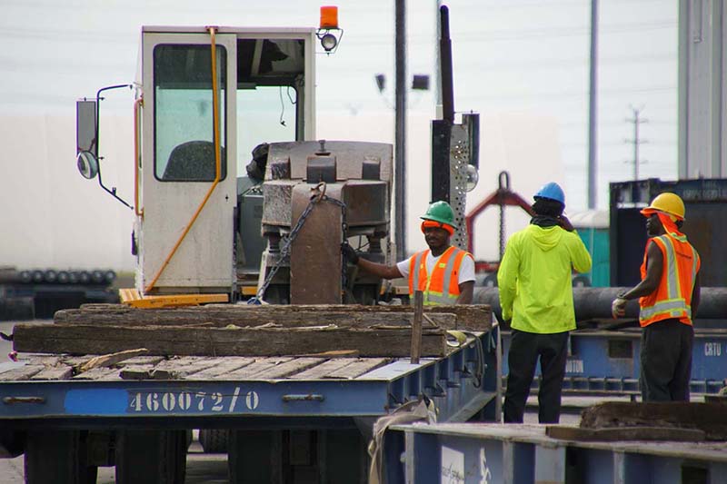 port freeport employees standing near a truck port freeport employees standing near a truck